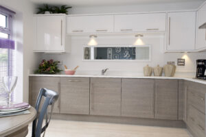 Contemporary kitchen with a combination of textured wood grain cabinetry and sleek white surfaces, highlighting the beauty of contrasting finishes.