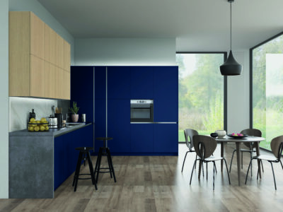 Modern kitchen with sleek indigo blue cabinets, oak upper cabinetry, integrated appliances, and minimalist design, showcasing a contemporary aesthetic.